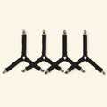 Four adjustable black fitted-sheet corner straps with metal clips